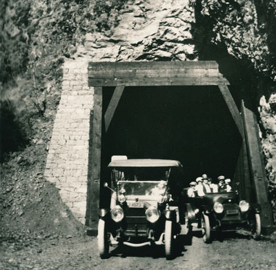 A car passes another car as they leave the west end of the Oneonta Tunnel in 1916