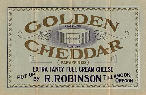 Drawing of cheddar wheel of cheese with the words "Golden Cheddar" arched around. 