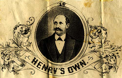 Drawing of man in suit with mustache in oval. Below a banner reads "Henry's Own"