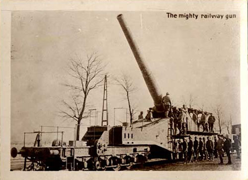 Artillery gun with mussle pointed skyward. Words "The Mighty Railway gun" printed on photo.