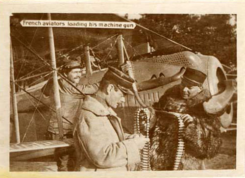 French aviator loading his machine gun on his plane