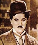 Photo of Charlie Chaplin wearing hat and tie.