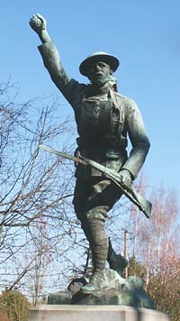 Stone statue of soldier carrying rifle