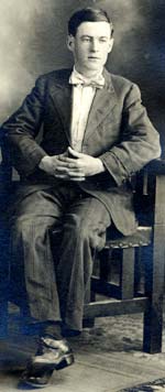 Corporal Frank Burns sitting in a chair for formal photo.