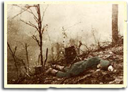German soldier lies dead on hillside.
