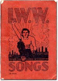 Song book of the IWW shows a man reaching 1 arm forward and industrial building with smoke stacks in background.