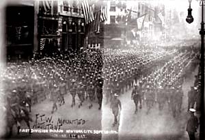 Black and white photo of hundreds of soldiers marching down a street in NY.