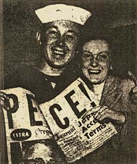 Photo of sailor and woman smiling at camera & holding paper with headline "Peace!" Subheading reads "Japs Accept Terms"
