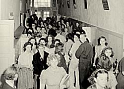 Photo of a crowded high school hall with little room for movement.