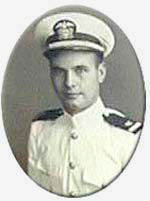 Photo of man in white military dress with hat.