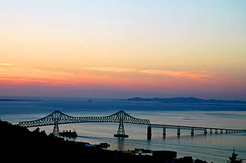 Bridge over Columbia River at sunset.