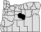 Map of Oregon with center area blacked out to indicate Crook County.