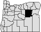 Map of Oregon with section in eastern section blacked out to indicate Grant County.