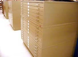 Metal cases with long, thin drawers, 15 drawers high, hold maps and architectural plans.