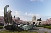 Fountain in the Capitol Mall with the Capitol building in the background. Cherry blossoms on trees line the side.