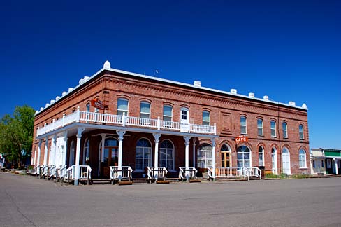 Two story brick hotel takes up a city block.