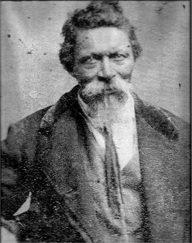 Photo of John Dudley Mathews, a black man with a bushy beard and mustache.