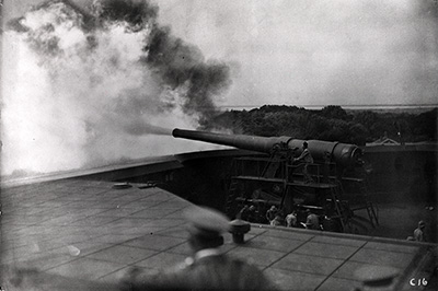 A black and white photo from 1971 of a cannon firing. 