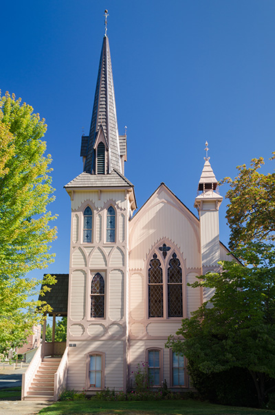 Church of Victorian Gothic architecture. Brick foundation, wood frame, roof & belfry. Completed in 1881.