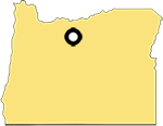 Outline of the state of Oregon with a marker in the upper middle to denote the location of the town of Kent.