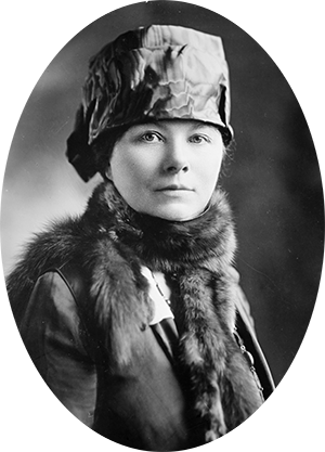 Photo of Esther Lovejoy wearing a form fitting hat, mink stole around her neck.