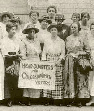 14 African-American women pose with a sign reading: Head-Quarters for Colored Women Voters