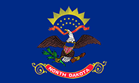 North Dakota flag features a bald eagle holding an olive branch and a bundle of arrows. The eagle carries a ribbon in its beak with the words: E Pluribus Unum 
