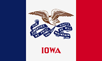 Iowa flag has 3 vertical stripes in blue, white and red. On the white center an eagle carries streamers in its beak with the state motto.