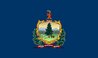 Vermont flag has the state coat-of-arms in the center featuring a green landscape with mountains in the back. A pine tree is in the center, with a red cow on the side of the field. The background is blue.