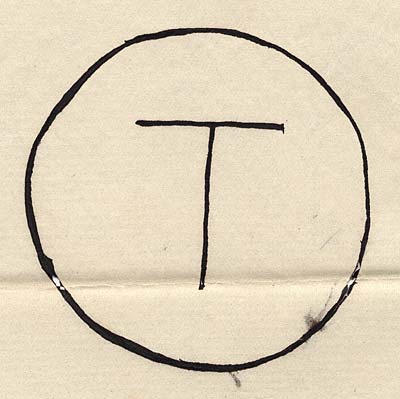 Drawing of the letter T enclosed in a circle.