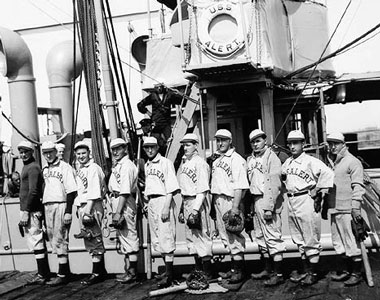 10 members of naval baseball team pose for photo