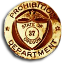 Gold badge with image of eagle and the words "Prohibition department, state of Oregon, 37" inscribed.