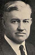 Photo of Senator Rufus Holman in suit and tie.