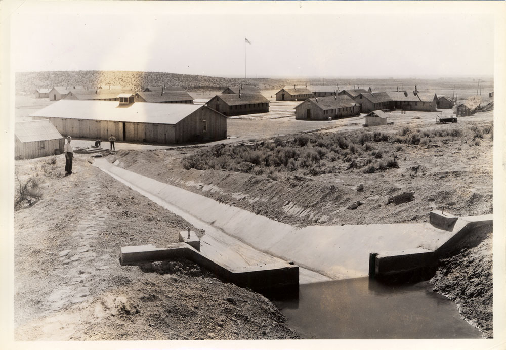 Civiliam Conservation Corps Camp buildings shown in baren landscape.