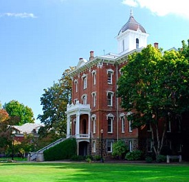 A 4 story, red brick building with bell tower. Pioneer Hall is the oldest building on Linfield's campus.