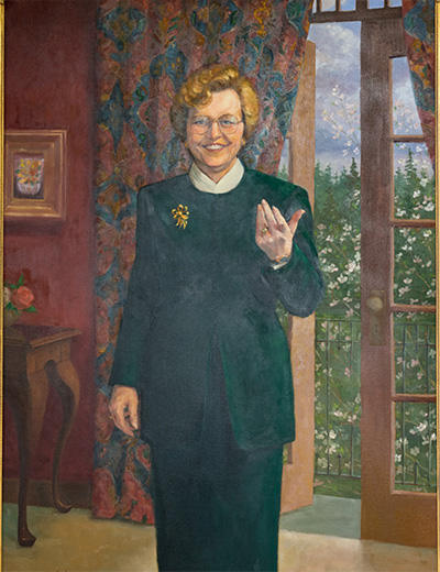 Painting of Barbara Roberts standing in front of an open French door and holing her hand out.