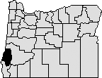 Map of Oregon with section near southwestern corner blacked out to show Coos County.