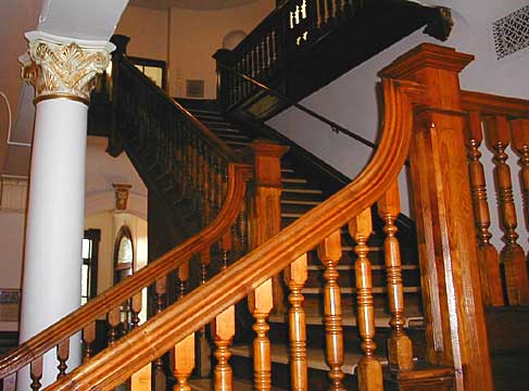 Wooden stairs in lobby of courthouse.