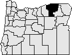 Map of the state of Oregon with Umatilla county on the north east side blacked out.