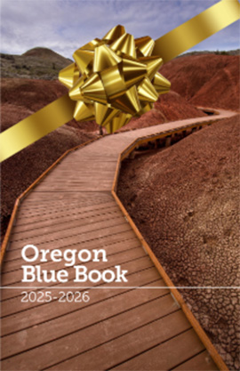 Cover of the Oregon Blue Book shows a wooden walkway in the John Day Fossil Beds.