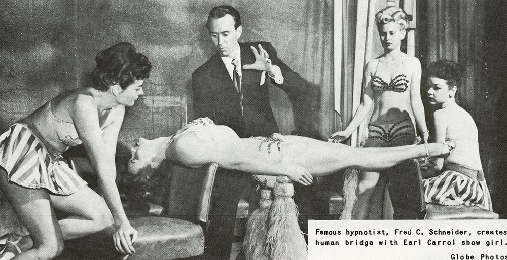 A hypnotist and assistants perform a show