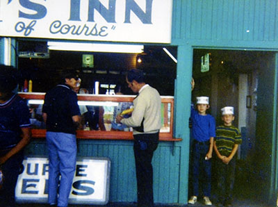 People standing in front of the Chef's Inn