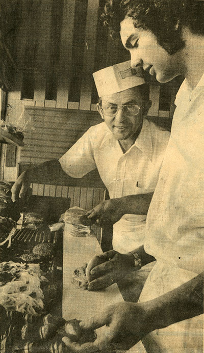 Two men work in the Chef's Inn kitchen