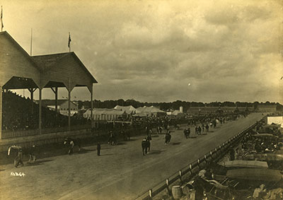 Horses parade by the Grandstand