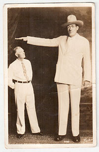 Giant man Clifford Thompson poses with a much smaller man