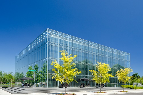 Glass structure. Described by the architect as resting on a "table of water" and a birch forest celebrating regional environment