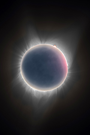The sun shown during an eclipse with a dark center and light ring around the rim.