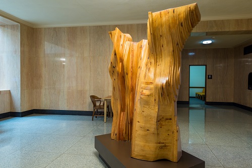Abstract public sculpture displayed inside the Oregon State Capitol in Salem, featuring organic forms and smooth surfaces.