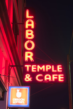 neon sign in Astoria reads Labor Temple & Cafe.