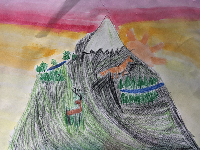 Drawing of a mountain with deer and trees. A colorful sunset in the sky.